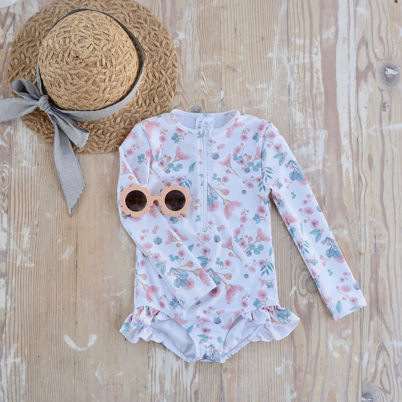 Willow Swim Sophia girls swimsuit in Gumnuts lifestyle shot with hat and sunnies